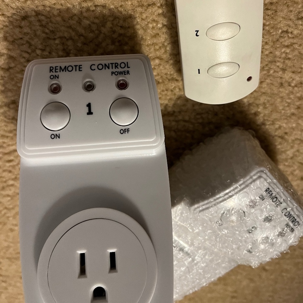 PAIR of PLUG  -IN TIMERS WITH REMOTES